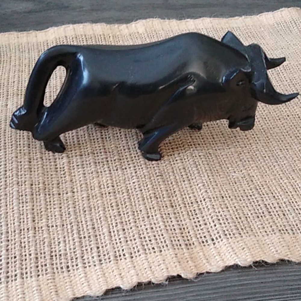 Hand carved black stone bull paperweight